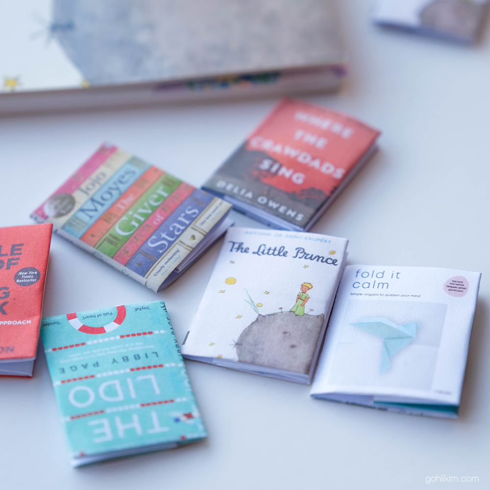 Different Mini Book paper clips on a white background